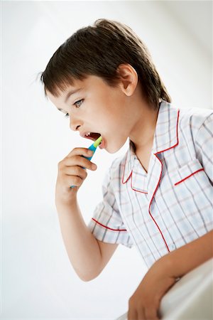 Little Boy Brushing Teeth in bathroom Stock Photo - Premium Royalty-Free, Code: 693-03557238