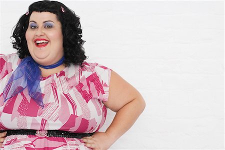 dress for fat women - Overweight Woman posing with hands on hips, portrait Stock Photo - Premium Royalty-Free, Code: 693-03557448