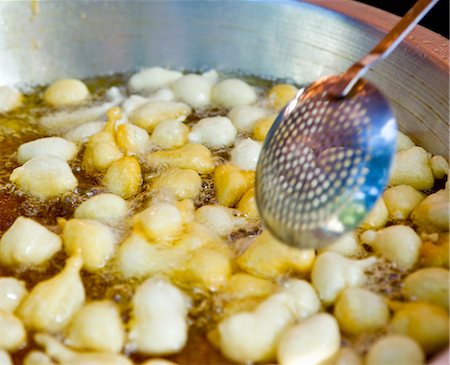 frying - Traditional frying of dough balls, (Lokoumathes),  Limassol,  Cyprus Stock Photo - Premium Royalty-Free, Code: 693-03557881