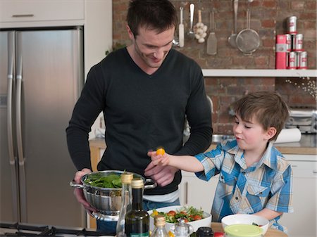 pictures of kids helping parents with dishes - Father and Son Preparing Salad Stock Photo - Premium Royalty-Free, Code: 693-03564380