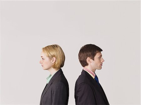 simsearch:693-03564532,k - Business people standing back to back, on white background Stock Photo - Premium Royalty-Free, Code: 693-03564562