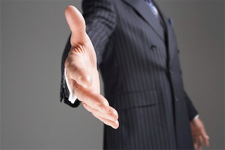 Businessman Offering Hand, mid-section Stock Photo - Premium Royalty-Free, Code: 693-03565263