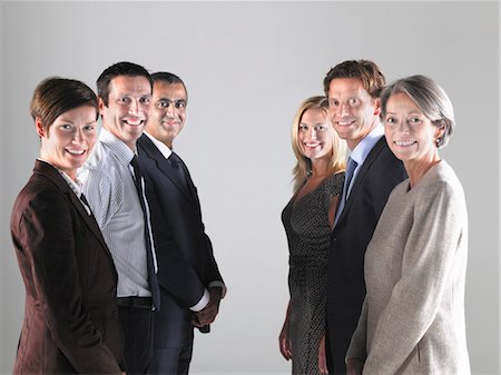 facing - Two groups of businesspeople in two rows Stock Photo - Premium Royalty-Free, Code: 693-03565287