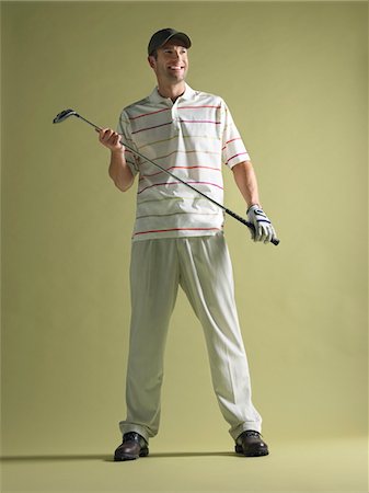 simsearch:693-03565397,k - Golfer standing holding club Stock Photo - Premium Royalty-Free, Code: 693-03565404