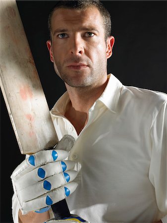 Cricket player holding cricket bat, portrait Stock Photo - Premium Royalty-Free, Code: 693-03565401