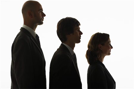 Businesspeople standing in row, in height order, profile Stock Photo - Premium Royalty-Free, Code: 693-03565572