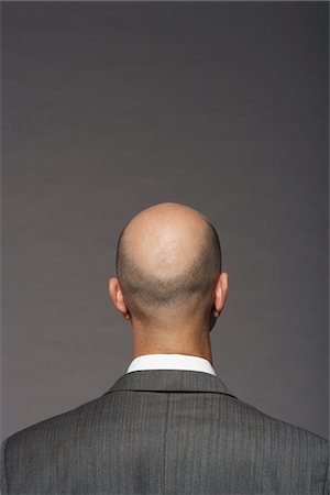 Businessman with Bald Head Fotografie stock - Premium Royalty-Free, Codice: 693-03565583