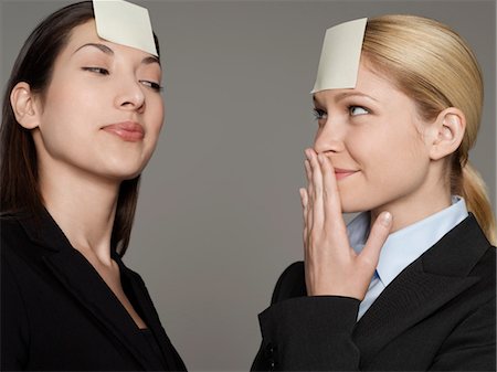 simsearch:693-03564532,k - Portrait of two female office workers with sticky notes on forehead Stock Photo - Premium Royalty-Free, Code: 693-03565600