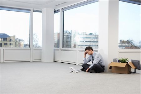 Businessman in Empty Office Space Fotografie stock - Premium Royalty-Free, Codice: 693-03565721