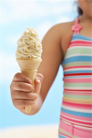 Girl (7-9 years) holding icecream, mid section Stock Photo - Premium Royalty-Free, Code: 693-03565745