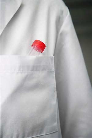 Scientist with test tube in lab coat pocket, close-up Stock Photo - Premium Royalty-Free, Code: 693-03565797