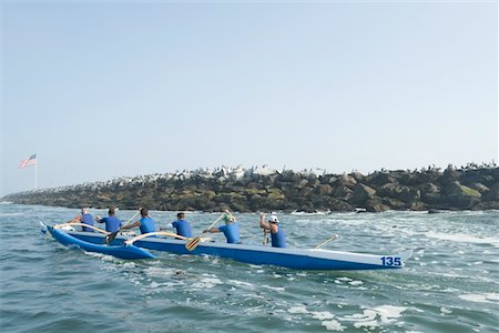 Outrigger canoeing team on water Stock Photo - Premium Royalty-Free, Code: 693-03617051