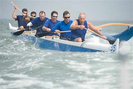 Outrigger canoeing team on water Stock Photo - Premium Royalty-Free, Code: 693-03617072