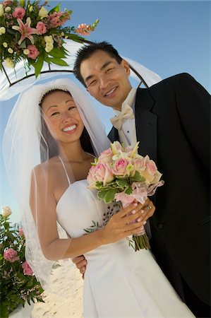 simsearch:693-03686309,k - Bride and Groom under archway, (portrait) Stock Photo - Premium Royalty-Free, Code: 693-03686311