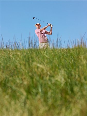 simsearch:693-03304456,k - Male golfer driving ball Foto de stock - Sin royalties Premium, Código: 693-03686738