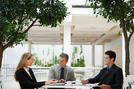 simsearch:693-03707355,k - Three businesspeople working outdoors Stock Photo - Premium Royalty-Free, Code: 693-03686786