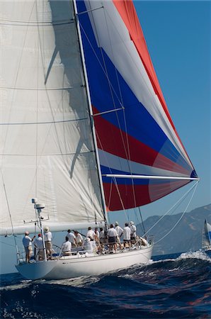 sailboat racing - Yacht on ocean with full sail Stock Photo - Premium Royalty-Free, Code: 693-03706925