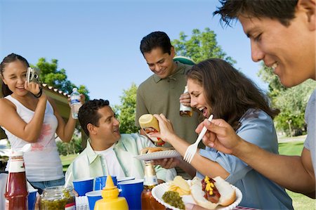 family gathering, holiday - Family at outdoors picnic. Stock Photo - Premium Royalty-Free, Code: 693-03706944