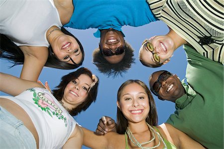 group of friends in circle, view from below, portrait Stock Photo - Premium Royalty-Free, Code: 693-03706990