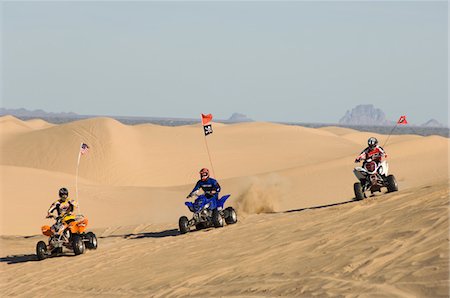 quad biking - Three Young Men Riding ATVs on Dunes Stock Photo - Premium Royalty-Free, Code: 693-03707119