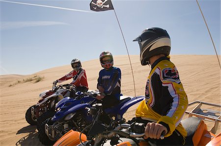 quad biking - Three Young Men on ATVs Stock Photo - Premium Royalty-Free, Code: 693-03707110