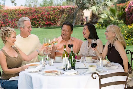 simsearch:693-06015925,k - Friends toasting at outdoor table Stock Photo - Premium Royalty-Free, Code: 693-03707146