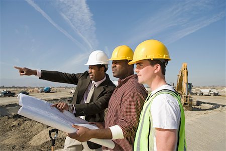 Surveyor and construction workers on site Stock Photo - Premium Royalty-Free, Code: 693-03707179