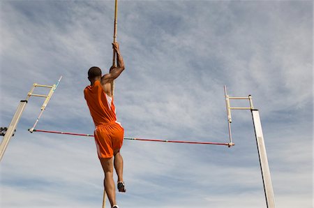 Pole vaulted taking off, low angle view Foto de stock - Royalty Free Premium, Número: 693-03707244