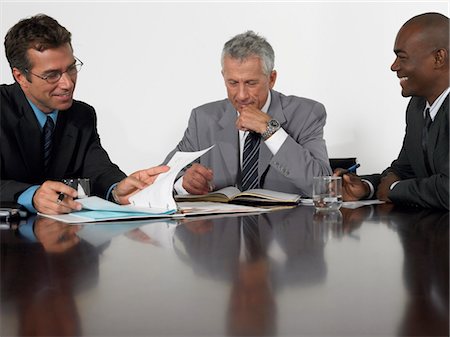 simsearch:693-03707355,k - Three businessmen in conference meeting Stock Photo - Premium Royalty-Free, Code: 693-03707306