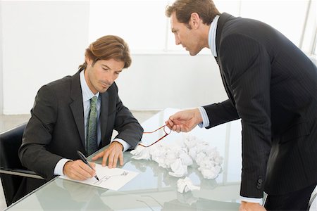 simsearch:693-03707355,k - Business men working in conference room Stock Photo - Premium Royalty-Free, Code: 693-03707324