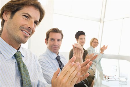 simsearch:693-03707355,k - Business colleagues applauding in conference meeting Stock Photo - Premium Royalty-Free, Code: 693-03707337