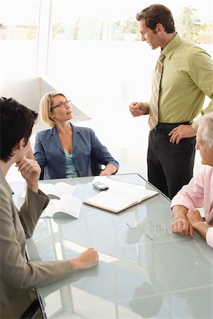simsearch:693-03707355,k - Business colleagues working in conference room Stock Photo - Premium Royalty-Free, Code: 693-03707354