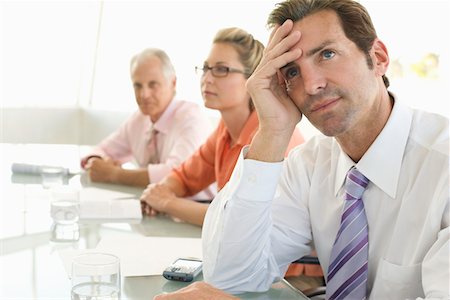 simsearch:693-03707355,k - Business colleagues in conference meeting Stock Photo - Premium Royalty-Free, Code: 693-03707358