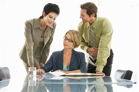 simsearch:693-06019591,k - Business colleagues working in conference room Stock Photo - Premium Royalty-Free, Code: 693-03707351