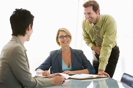 simsearch:693-03707355,k - Business colleagues working in conference room Stock Photo - Premium Royalty-Free, Code: 693-03707352