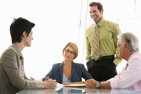 simsearch:693-06019591,k - Business colleagues working in conference room Stock Photo - Premium Royalty-Free, Code: 693-03707353