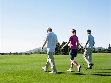 simsearch:693-03304456,k - Three young golfers on course, back view Foto de stock - Sin royalties Premium, Código: 693-03707755