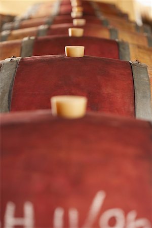 Wine casks lying down in order, selective focus Stock Photo - Premium Royalty-Free, Code: 693-03707775