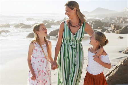 Mother With Children at Beach Stock Photo - Premium Royalty-Free, Code: 693-03707819