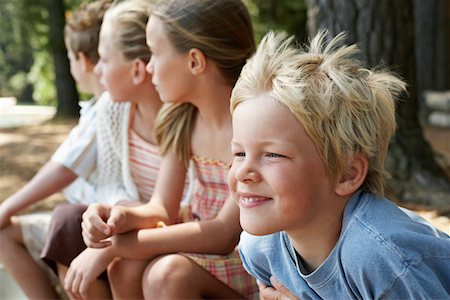 simsearch:693-03314791,k - Four children (7-9) sitting in forest, close-up. Stock Photo - Premium Royalty-Free, Code: 693-03707822