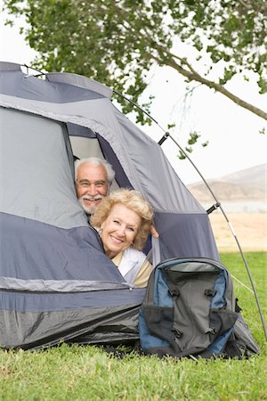 senior backpack - Senior couple with heads at tent flap Stock Photo - Premium Royalty-Free, Code: 693-03707958