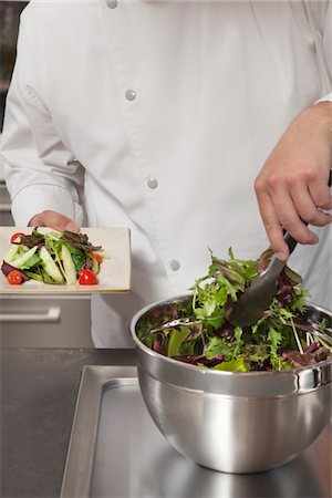 Mid- adult chef prepares leaf vegetables Stock Photo - Premium Royalty-Free, Code: 693-03782525