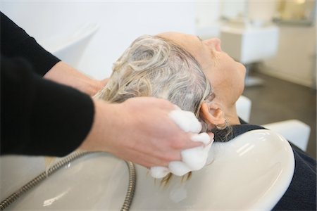 salon for older people - Shampooing hair in salon basin Stock Photo - Premium Royalty-Free, Code: 693-03782575