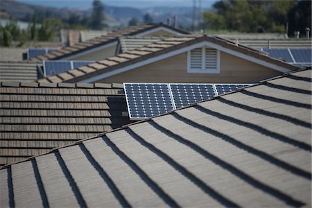 solar panels and roof - Roof tops with some solar panelling on Stock Photo - Premium Royalty-Free, Code: 693-03782703