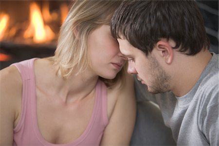 disappointment - Young couple kiss by open fire Stock Photo - Premium Royalty-Free, Code: 693-03782841