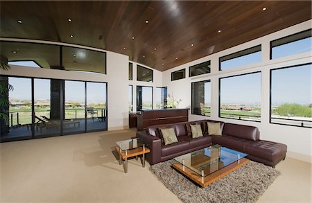 spacious - Interior with furniture and large windows with outside views Foto de stock - Sin royalties Premium, Código: 693-03782938