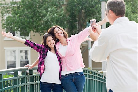 parents being silly - Man Taking Photograph of Mother and Daughter Stock Photo - Rights-Managed, Code: 700-04625371