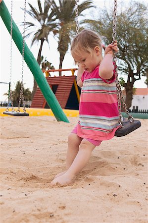 Petite fille sur la balançoire Photographie de stock - Rights-Managed, Code: 700-04926429