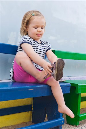 Little Girl Putting on Shoe Stock Photo - Rights-Managed, Code: 700-04926434