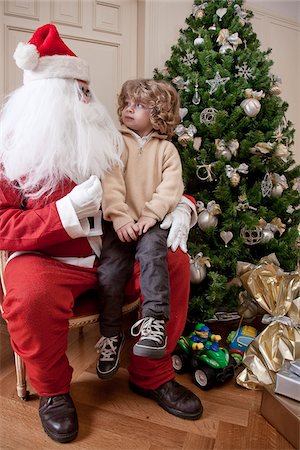 papá noel - Garçon assis sur les genoux du père Noël Photographie de stock - Rights-Managed, Code: 700-05281886